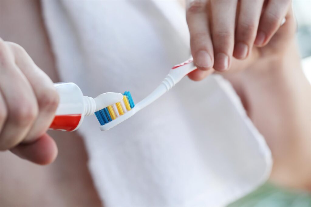 Man brushing teeth in the morning